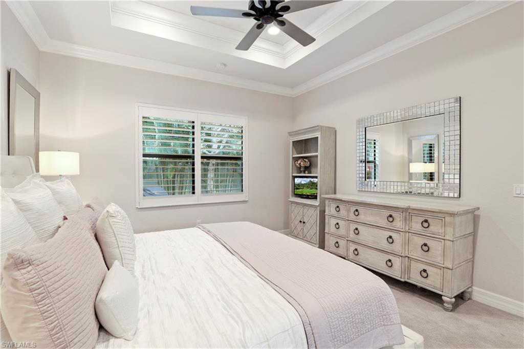 13435 Silktail Drive Naples, FL 34109 - Photo 12 of 27 a bedroom with a bed a window and dresser