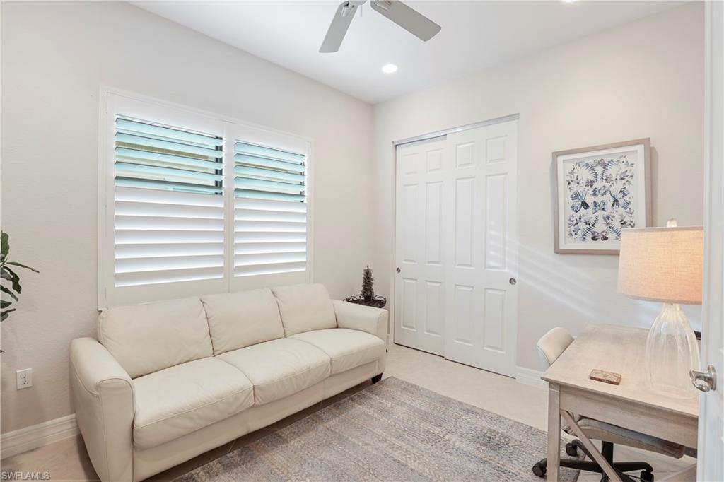 13435 Silktail Drive Naples, FL 34109 - Photo 13 of 27 a living room with furniture and a window