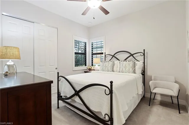 a bedroom with a bed and a desk