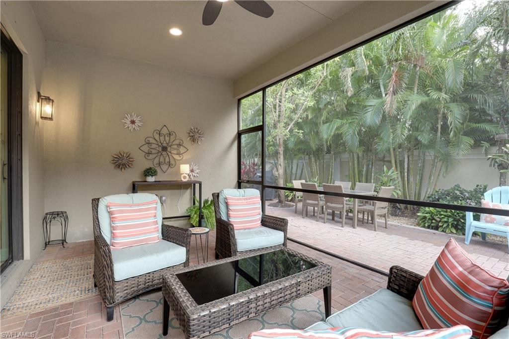 13435 Silktail Drive Naples, FL 34109 - Photo 17 of 27 a outdoor living space with furniture and a garden