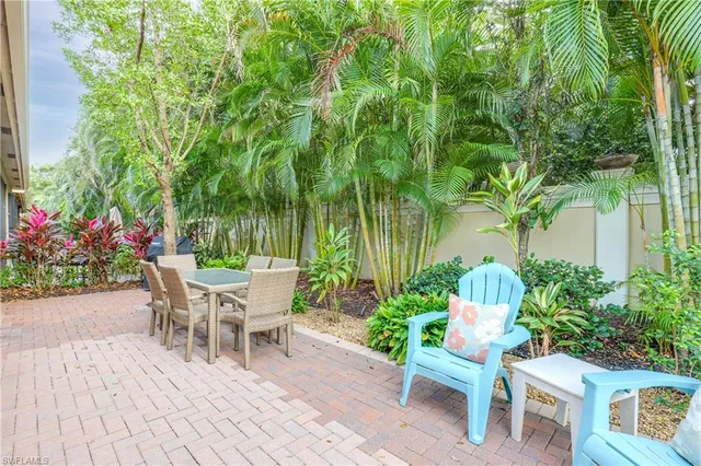 a view of a chairs and table in the patio