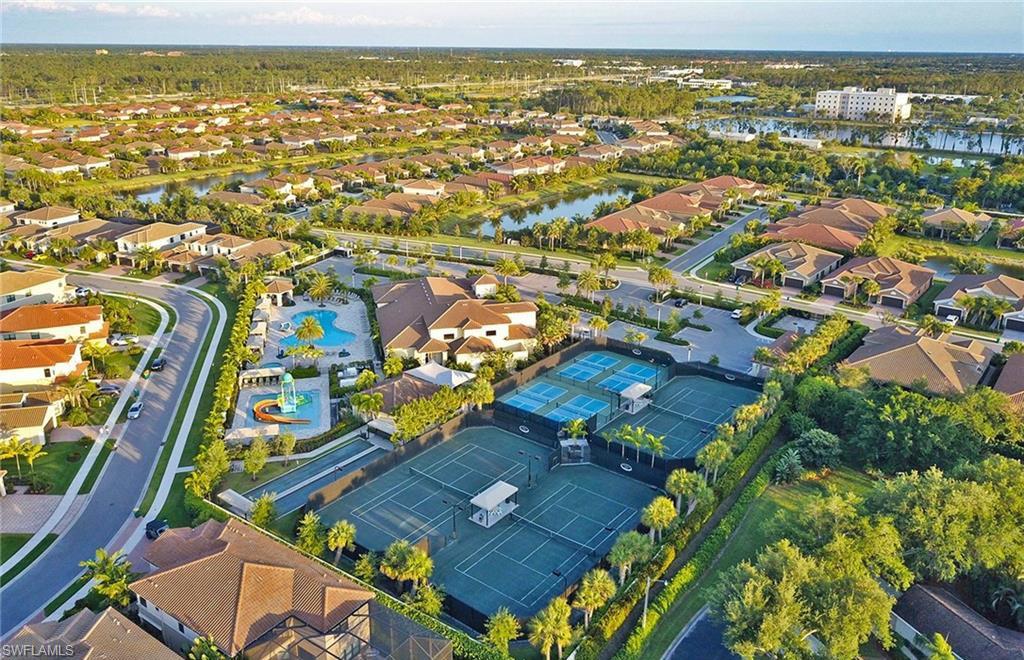 13435 Silktail Drive Naples, FL 34109 - Photo 22 of 27 an aerial view of residential houses with outdoor space