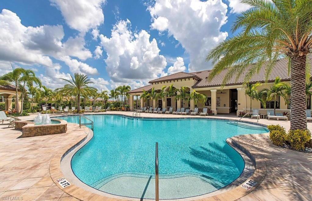 13435 Silktail Drive Naples, FL 34109 - Photo 26 of 27 a view of a swimming pool with a patio