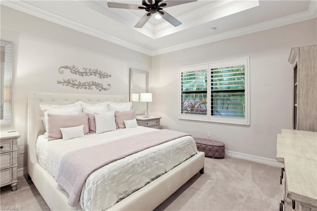 13435 Silktail Drive Naples, FL 34109 - Photo 10 of 27 a bedroom with a bed and window