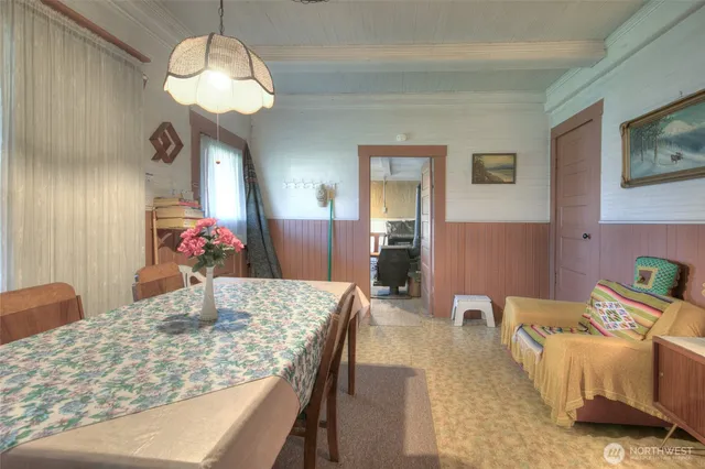 a living room with furniture and a lamp