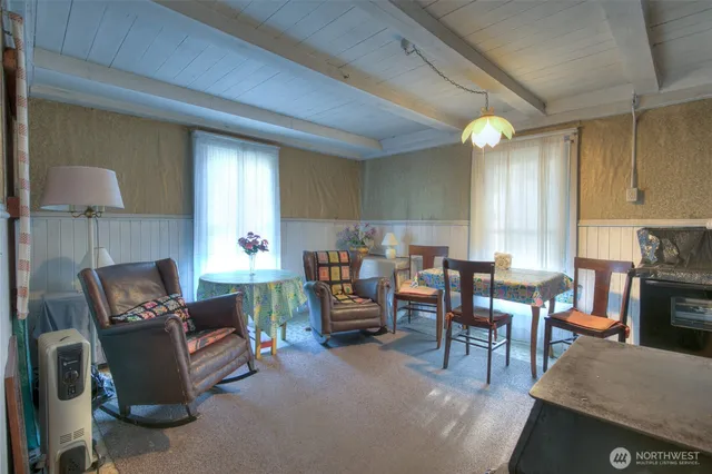 a bedroom with furniture and a lamp