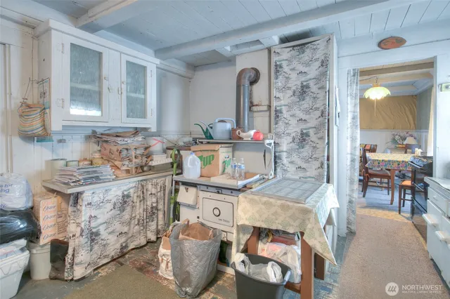 a utility room with sink dryer and washer