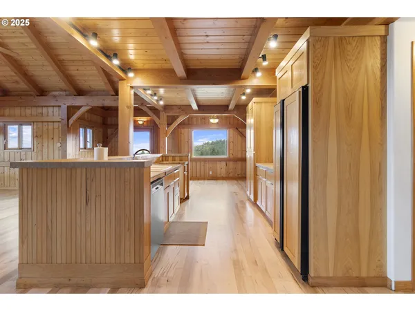 a view of a living room with hardwood floor