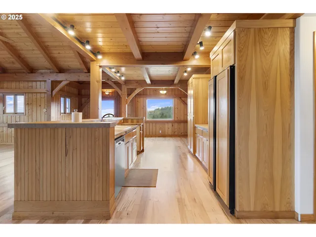 a view of a living room with hardwood floor