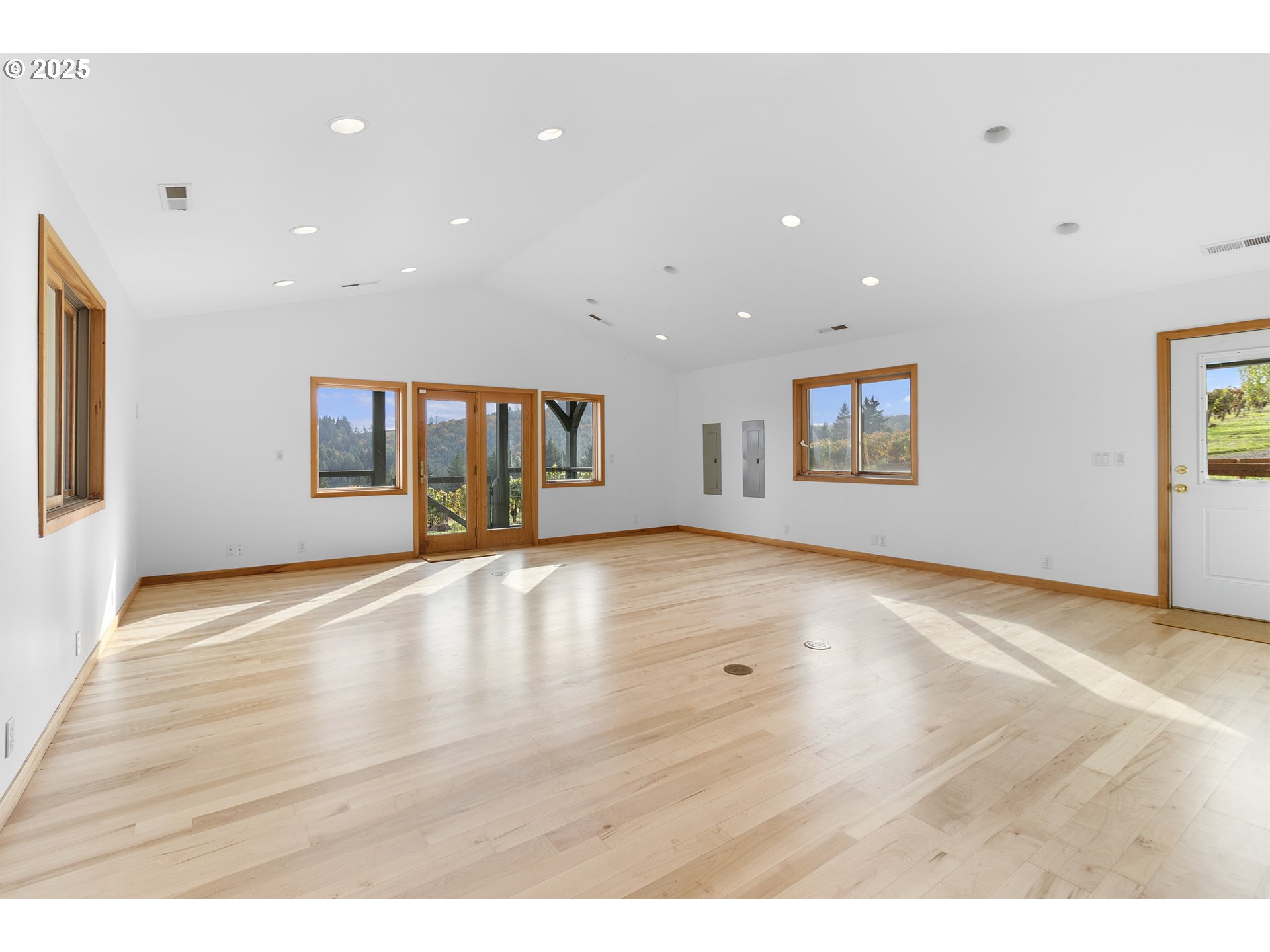 9325 Northeast Worden Hill Road Dundee, OR 97115 - Photo 15 of 48 a view of an empty room with wooden floor and a window