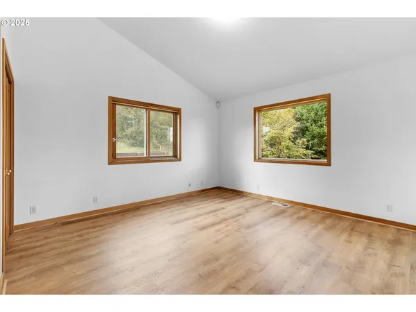 a bathroom with a granite countertop sink mirror and a bathtub