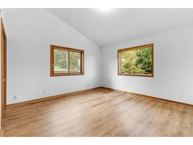 a bathroom with a granite countertop sink mirror and a bathtub