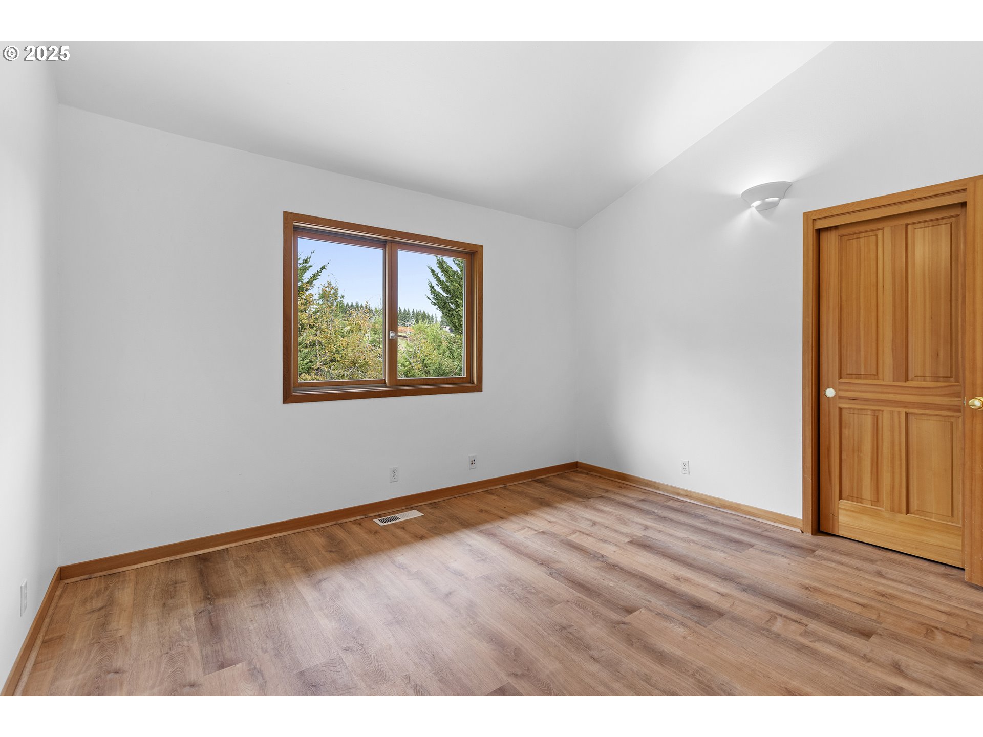 9325 Northeast Worden Hill Road Dundee, OR 97115 - Photo 18 of 48 an empty room with wooden floor closet and windows