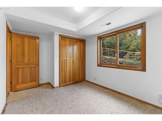 a view of balcony with wooden floor and seating space