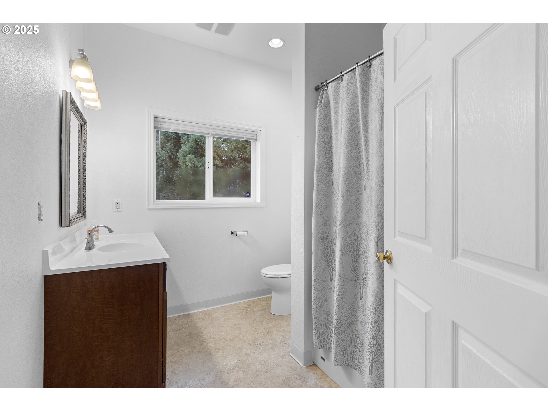 9325 Northeast Worden Hill Road Dundee, OR 97115 - Photo 33 of 48 a bathroom with a toilet sink and mirror