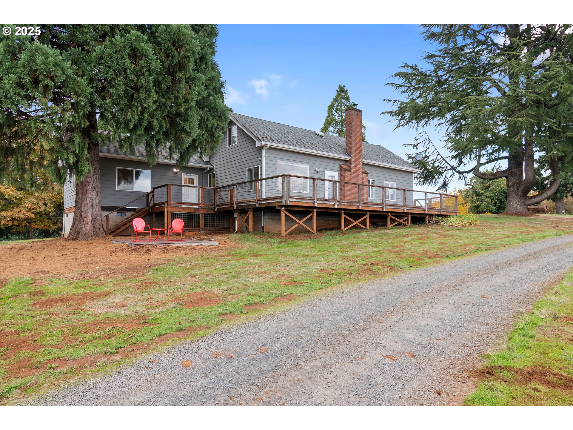 9325 Northeast Worden Hill Road Dundee, OR 97115 - Photo 36 of 48 a view of a house with a big yard and large trees