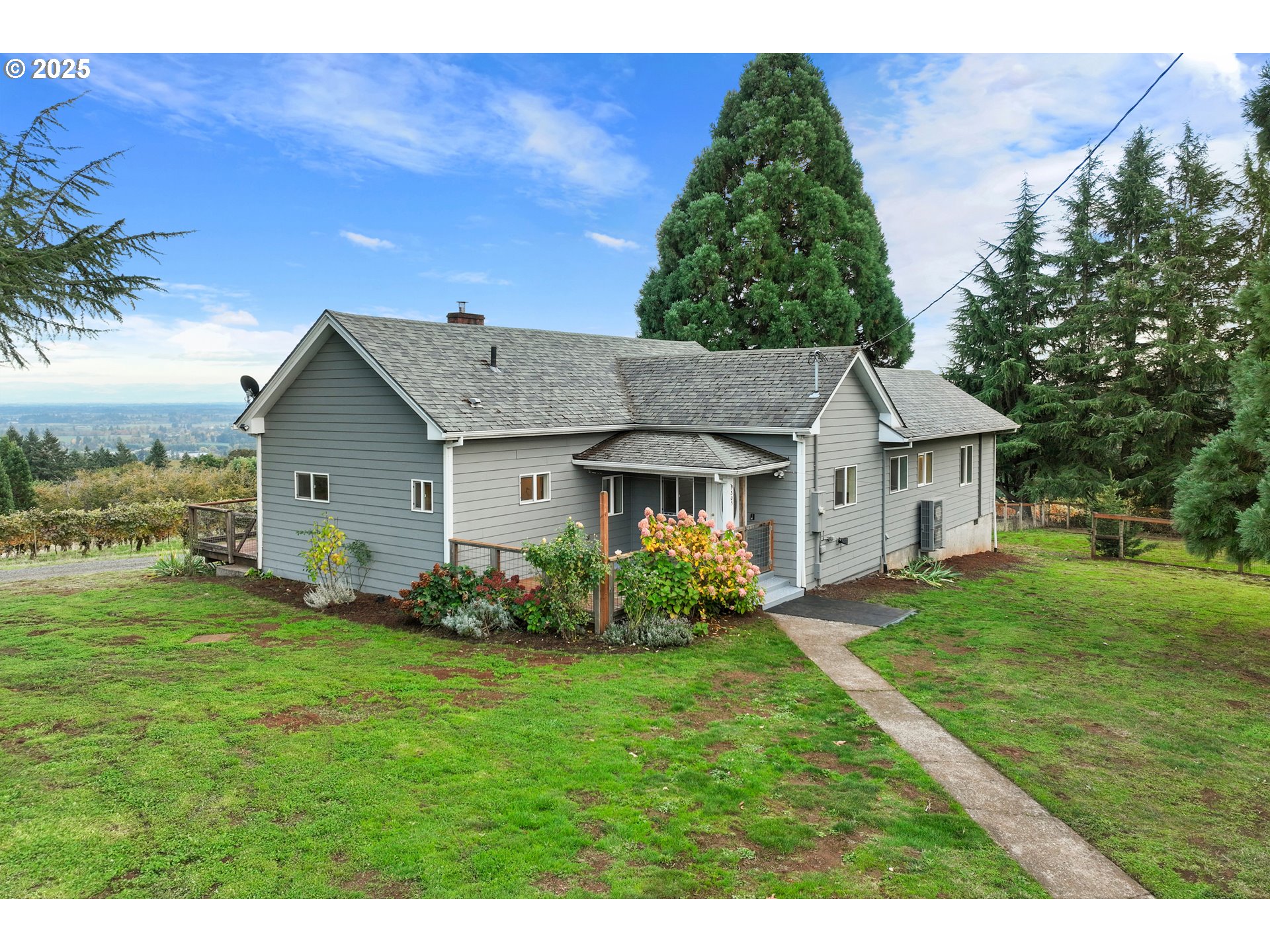 9325 Northeast Worden Hill Road Dundee, OR 97115 - Photo 6 of 48 a front view of a house with a garden