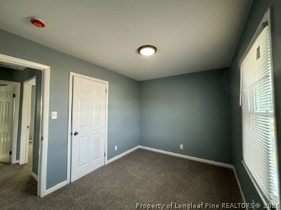 120 Calvin Street, Unit B Spring Lake, NC 28390 - Photo 4 of 7 an empty room with windows