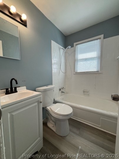 120 Calvin Street, Unit B Spring Lake, NC 28390 - Photo 6 of 7 a bathroom with a toilet a sink and bathtub