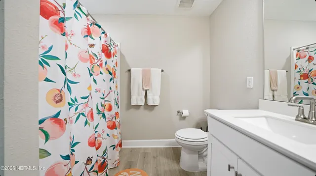 a bathroom with a sink and toilet