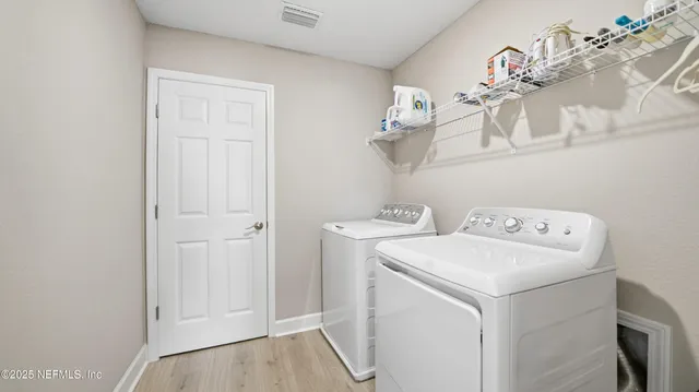 a view of a chairs and table in patio