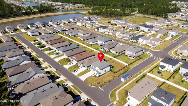 an aerial view of residential house with pool