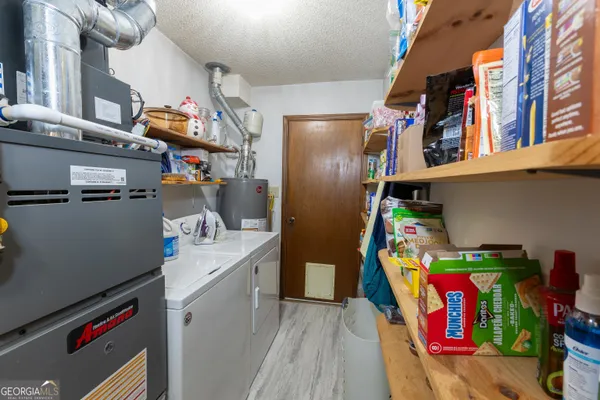 a view of a backyard with furniture and a backyard