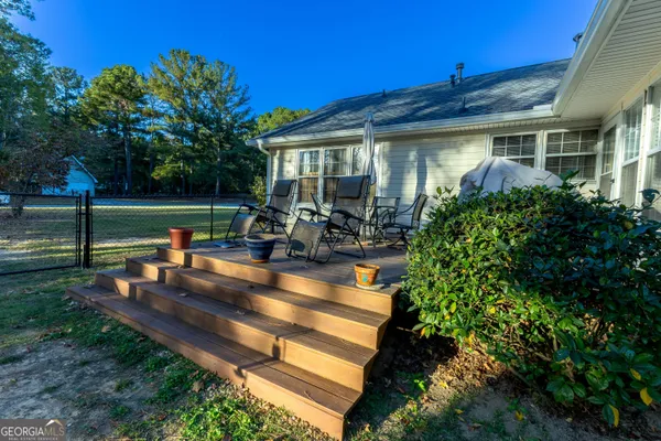 a backyard of a house with outdoor seating