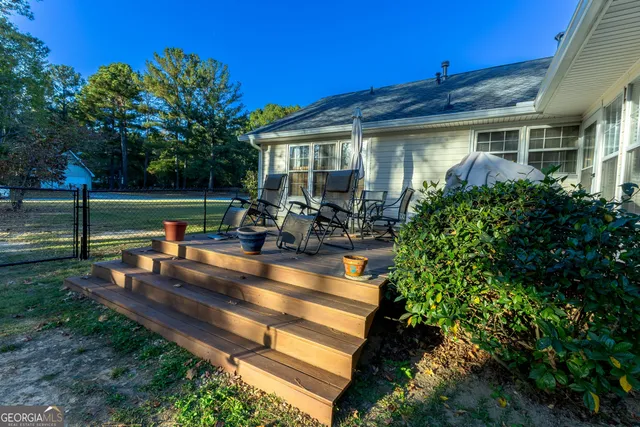 a backyard of a house with outdoor seating