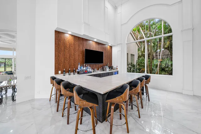 a view of a dining room with furniture window and outside view