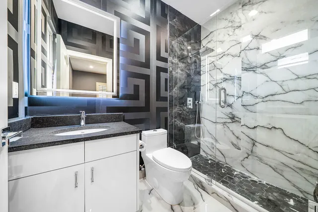 a en suite bathroom with a sink and mirror
