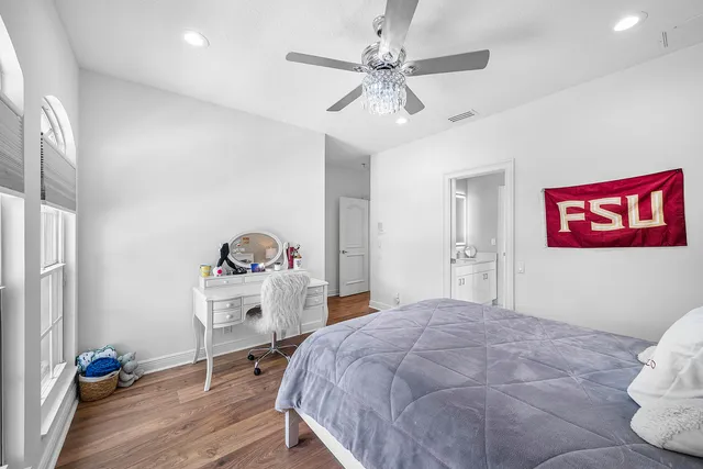 a living room with patio furniture and a floor to ceiling window