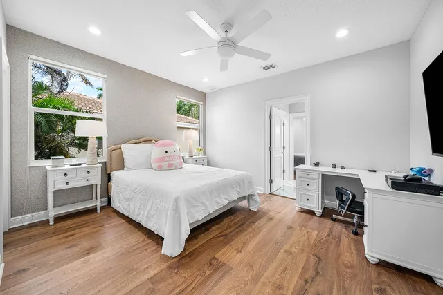 a view of a swimming pool with a lounge chair