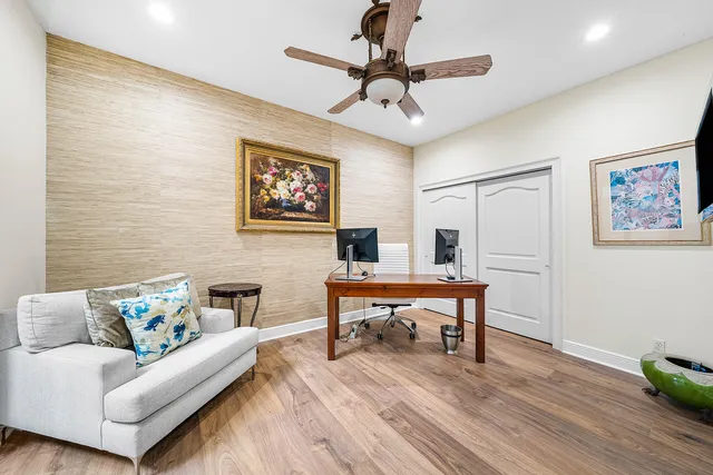 a view of a swimming pool with a garden and trees