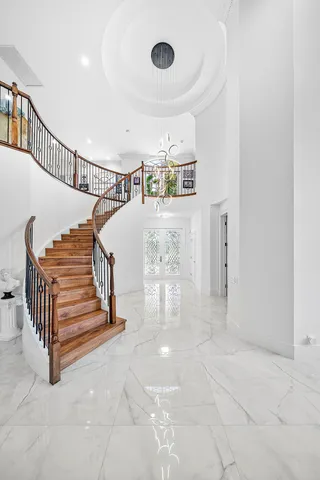 a large kitchen with a table and chairs