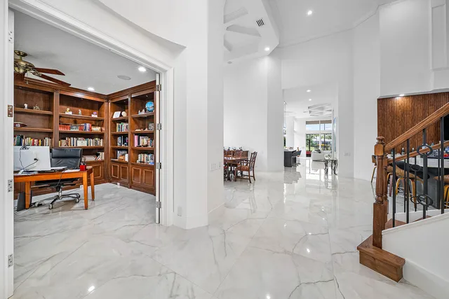 a large kitchen with a table and chairs