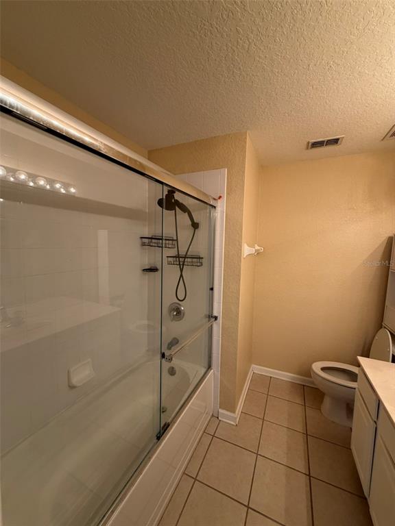 809 Shropshire Loop Sanford, FL 32771 - Photo 11 of 21 a bathroom with a shower and toilet