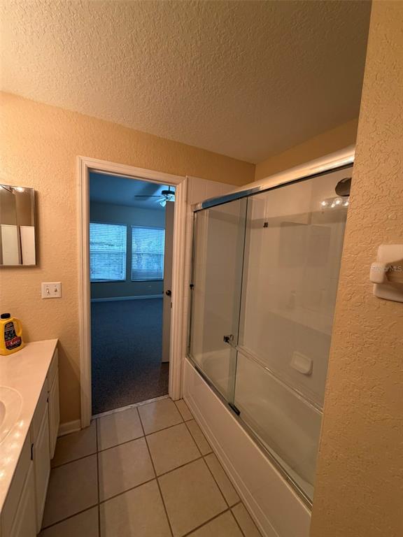 809 Shropshire Loop Sanford, FL 32771 - Photo 12 of 21 a bathroom with a shower and a sink