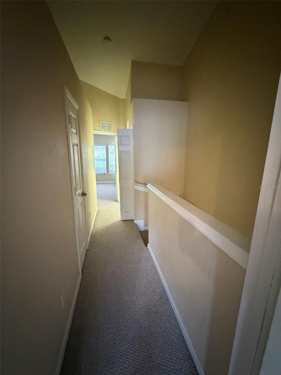 809 Shropshire Loop Sanford, FL 32771 - Photo 18 of 21 a view of hallway with toilet and sink