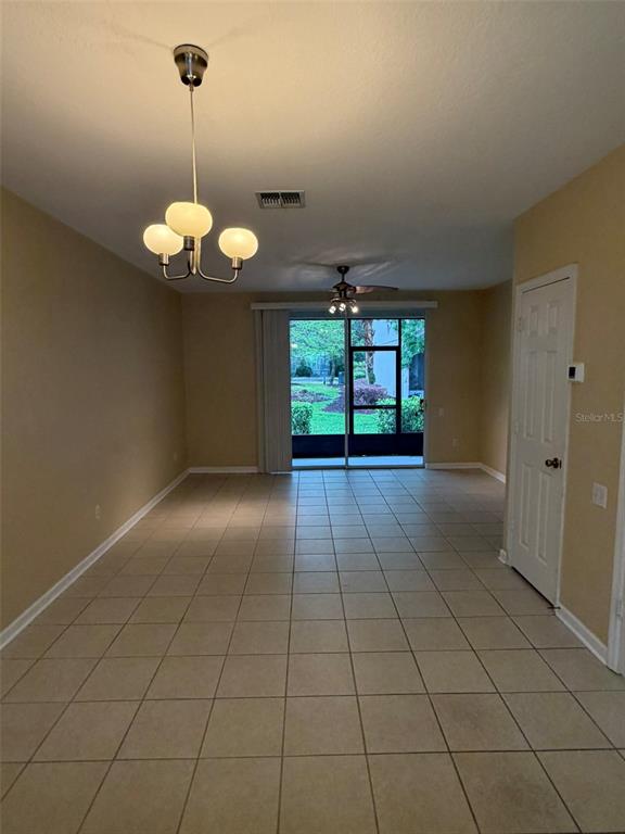809 Shropshire Loop Sanford, FL 32771 - Photo 5 of 21 a view of a livingroom with a chandelier furniture and windows