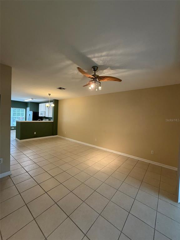 809 Shropshire Loop Sanford, FL 32771 - Photo 6 of 21 a view of a livingroom and a chandelier fan