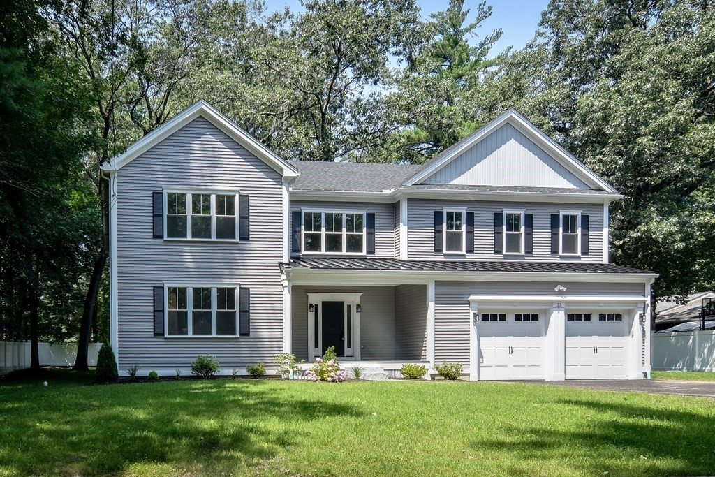 33 Birch Road Natick, MA 01760 - Photo 1 of 35 a front view of a house with a yard and trees