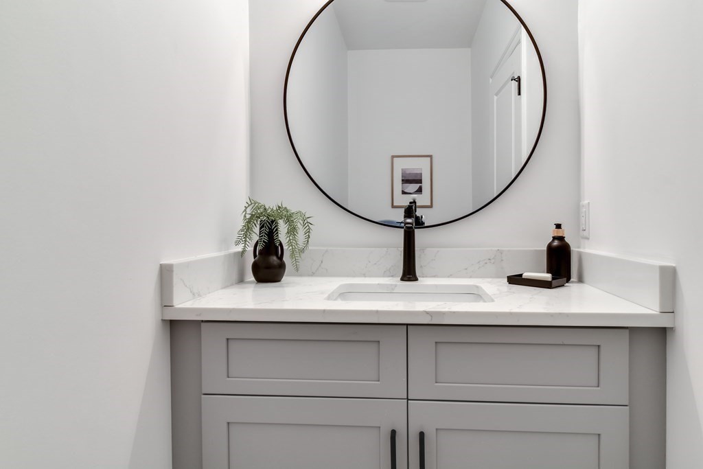 33 Birch Road Natick, MA 01760 - Photo 17 of 35 a bathroom with a sink and a mirror