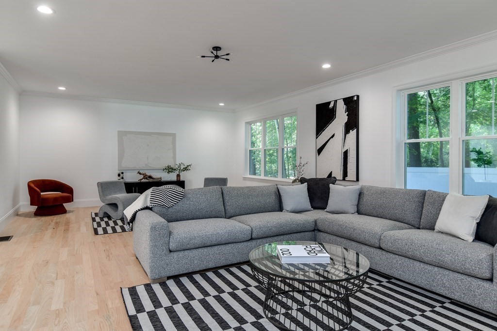 33 Birch Road Natick, MA 01760 - Photo 7 of 35 a living room with furniture ceiling fan and a window