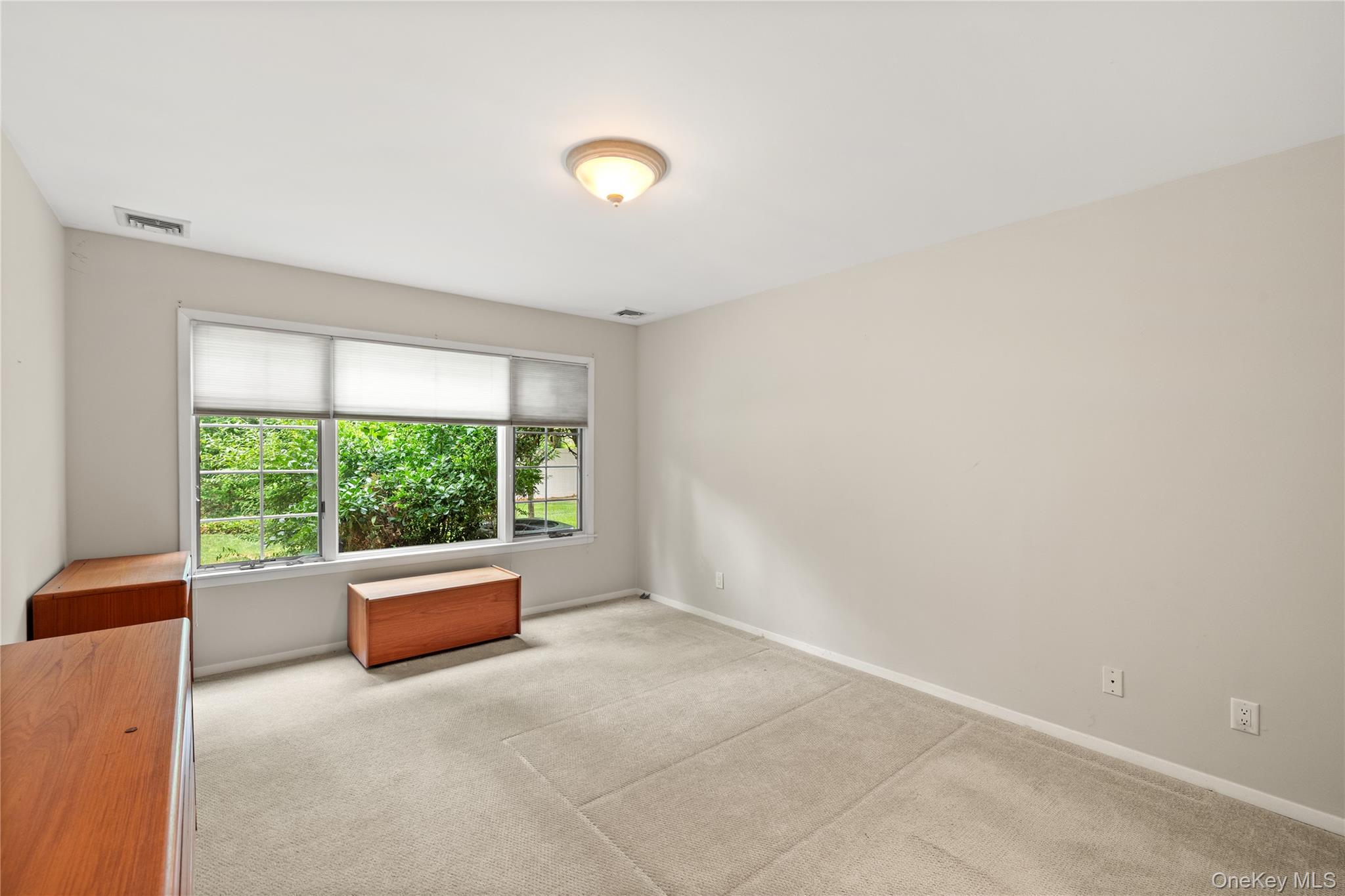 34 Cedar Ridge Lane Bay Shore, NY 11706 - Photo 12 of 27 a living room with a large window