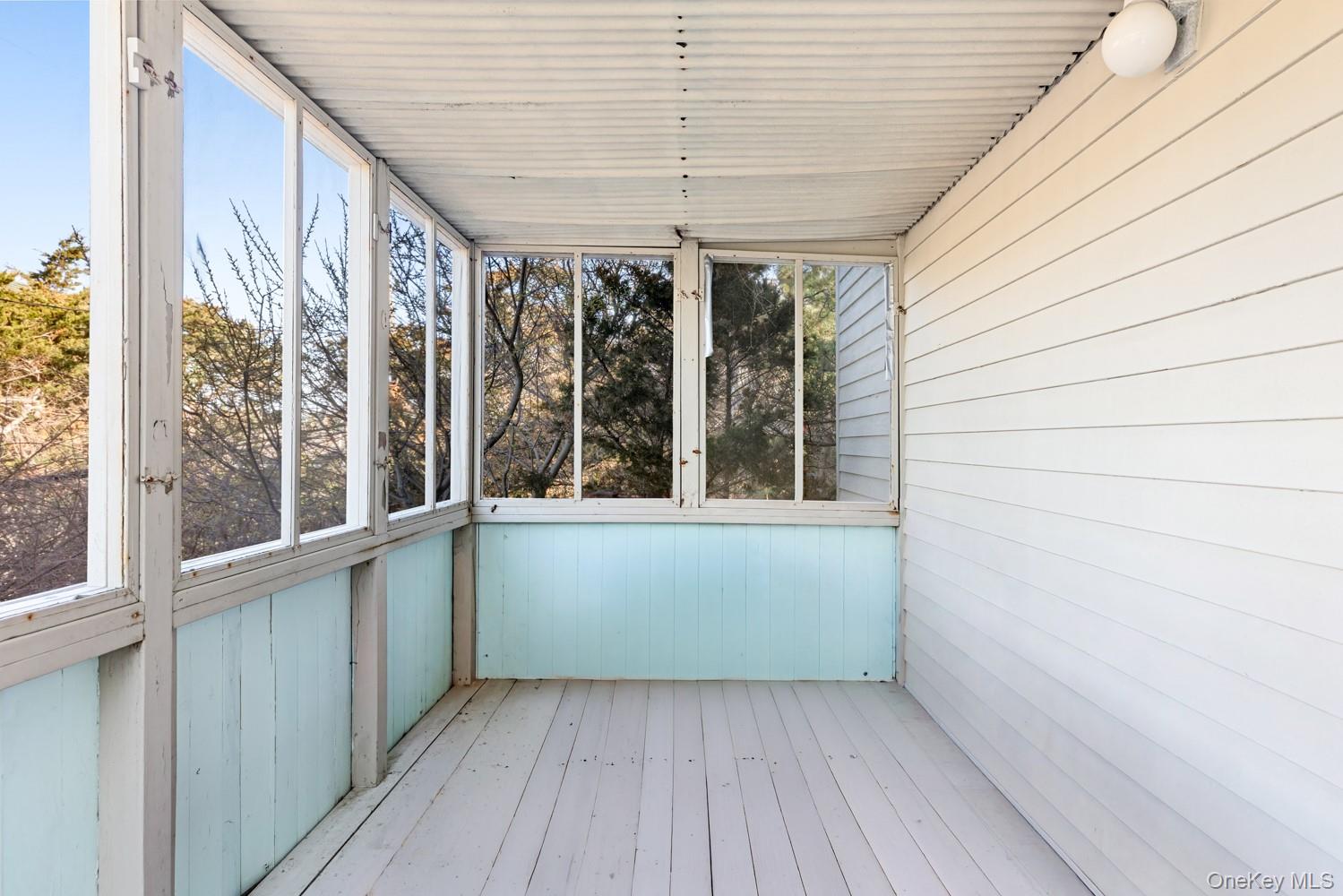 200 Clipper Road Ocean Beach, NY 11706 - Photo 11 of 29 a view of an empty room with a window