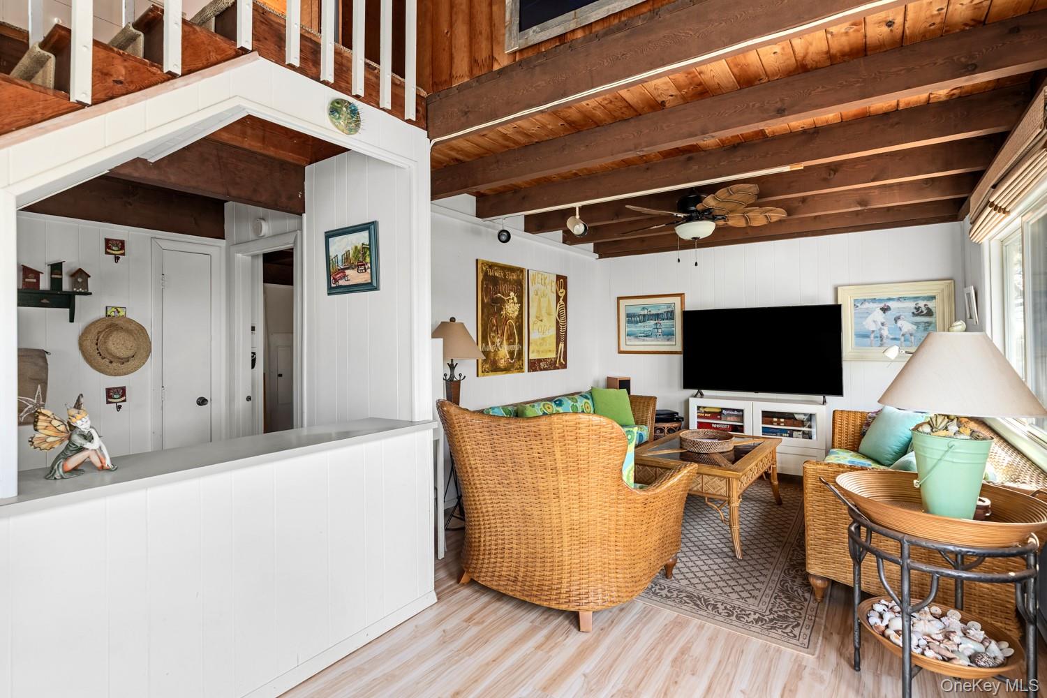 200 Clipper Road Ocean Beach, NY 11706 - Photo 14 of 29 a living room with furniture and a flat screen tv