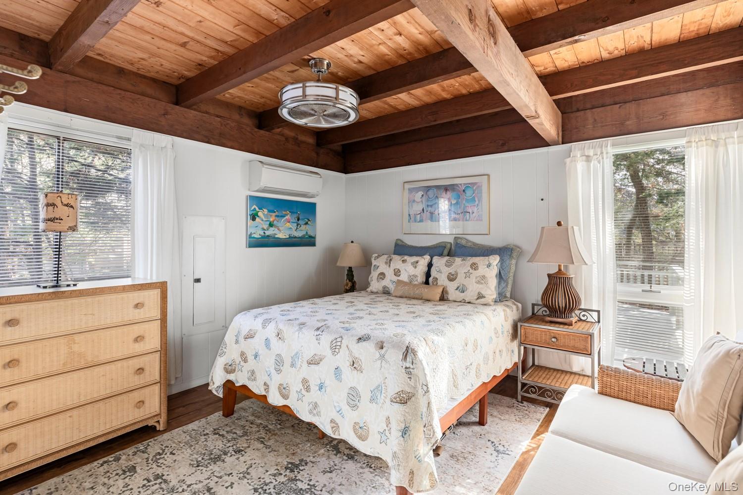 200 Clipper Road Ocean Beach, NY 11706 - Photo 17 of 29 a bedroom with a large bed and a large window