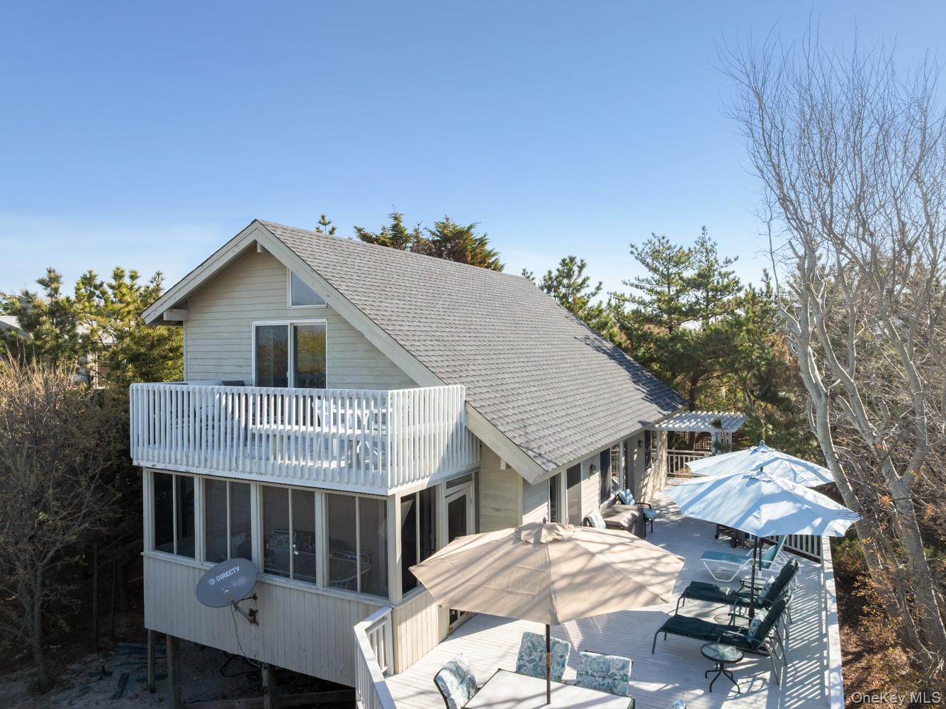 200 Clipper Road Ocean Beach, NY 11706 - Photo 2 of 29 a view of house with a roof deck