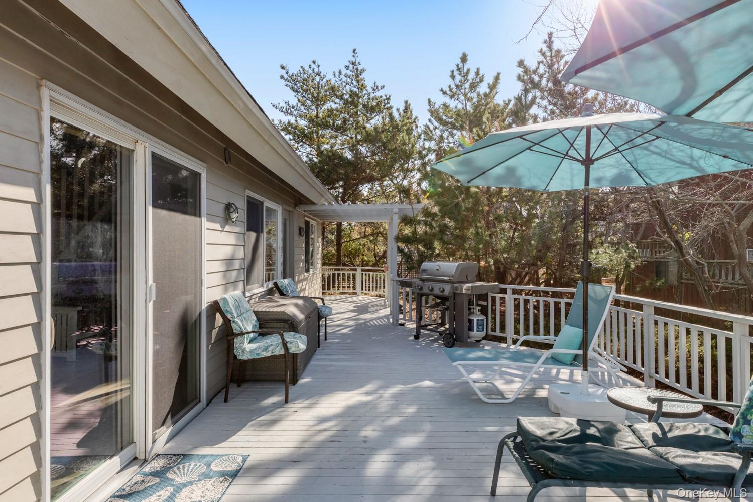 200 Clipper Road Ocean Beach, NY 11706 - Photo 24 of 29 a view of a chair and tables in the balcony